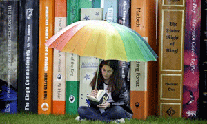 Girl Reading Book in the Rain 300px